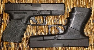 A Glock 23 (.40-cal) on top, and a Glock 19 (9-mm) on bottom.