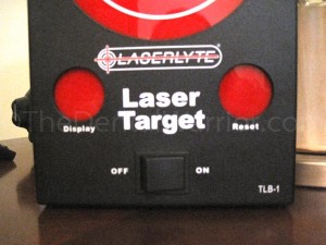 After shooting at the target, you fire the laser at the "Display" sensor to display your hits. Then you can shoot the "Reset" sensor to clear them and start over.